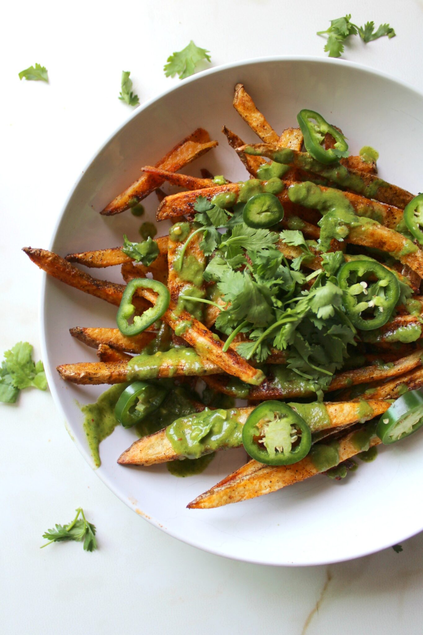 Loaded Baked Fries with Cilantro Lime Dressing This Savory Vegan