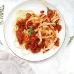 This Vegan Sunday Sauce is slow cooked on the stove all day long and is rich and flavor packed. The perfect Sunday dinner | ThisSavoryVegan.com #thissavoryvegan #pasta #vegansauce