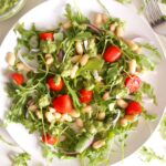 This Arugula White Bean Salad is topped with the best pesto/chimichurri dressing ever! | VEGAN + GF | ThisSavoryVegan.com