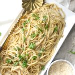 This Vegan Black Pepper Parmesan Spaghetti (or Cacio e Pepe) is a one pot meal that is creamy, comforting and simple. Ready in 20 minutes | ThisSavoryVegan.com