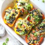 These Quinoa Stuffed Peppers with Vegan Jalapeno Cream Sauce are healthy and satisfying. Perfect meal prep lunch or dinner! | ThisSavoryVegan.com