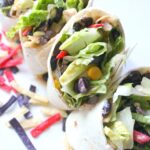Keep things cool and easy with this Southwest Veggie Wrap with Vegan Ranch. A super simple lunch or dinner packed full of veggies and lots of flavor! | ThisSavoryVegan.com