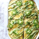 This Vegan Enchilada Casserole with Jalapeño Cream Sauce is the perfect make ahead meal for busy weeknights or Sunday meal prep | ThisSavoryVegan.com #thissavoryvegan #veganenchiladas #veganrecipe