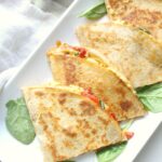 A quick and easy snack or dinner - these Simple Vegan Hummus Quesadillas are packed full of healthy mediterranean flavors. Ready in just 10 minutes! | ThisSavoryVegan.com