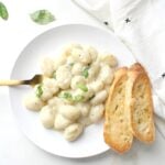 This Creamy White Wine Vegan Gnocchi is a rich and simple meal that will have you coming back for more. Ready in just 20 minutes! | ThisSavoryVegan.com #vegan #plantbased #pasta