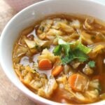 Perfect for those cold winter days, this Spicy Cabbage Detox Soup is packed full of veggies, spices and a delicious vegan beef broth | ThisSavoryVegan.com #vegan #vegansoup