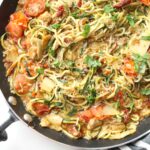 Lighten up "pasta night" with these Mediterranean Zucchini Noodles. A simple dinner recipe that combines cherry tomatoes, sun-dried tomatoes & artichoke hearts | ThisSavoryVegan.com #zoodles #veganpasta