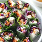 A simple lunch or dinner, these Vegan Rice Paper Rolls with Spicy Peanut Sauce are packed full of fresh veggies. Served with the best peanut sauce you've ever had! | ThisSavoryVegan.com #vegan #raw #mealprep