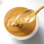 The perfect dip or dressing for salads, spring rolls or rice paper rolls - this Spicy Peanut Sauce is a delicious blend of flavors that is finger licking good | ThisSavoryVegan.com #vegan #peanutsauce #dressing