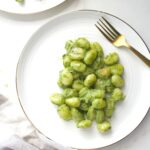 This Pan Seared Vegan Pesto Gnocchi combines gnocchi that have been browned in vegan butter with fresh pesto for a quick weeknight dinner | ThisSavoryVegan.com #thissavoryvegan #veganpasta #pesto
