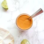 This Spicy Chipotle Tahini Sauce is the perfect topping for tacos, salads or bowls. Super creamy and just the right amount of zing | ThisSavoryVegan.com #thissavoryvegan #vegansauce #chipotle