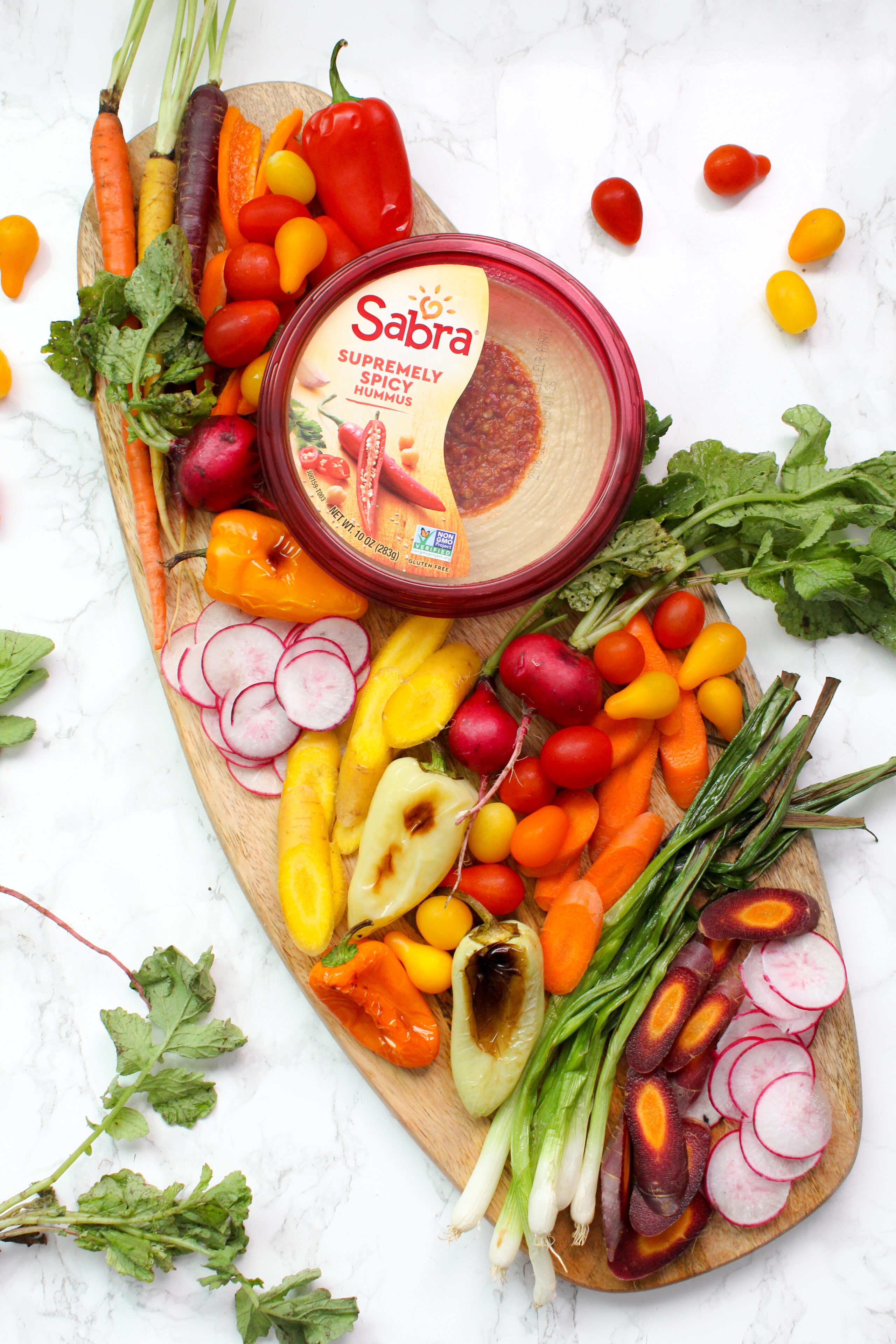 How to build a veggie hummus board - it is easier than you think when you have in season veggies and pre-made hummus at hand | ThisSavoryVegan.com #thissavoryvegan #hummusveggieboard #veganappetizer