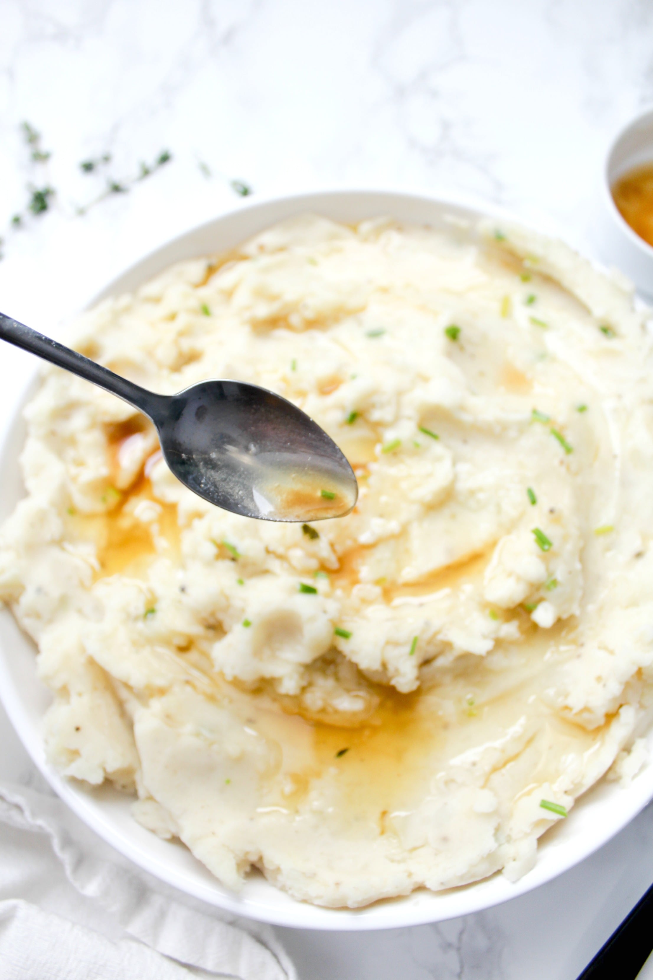 These Vegan Brown Butter Mashed Potatoes are what potato dreams are made of - these will be the star of the show at your next holiday dinner | ThisSavoryVegan.com #thissavoryvegan #veganthanksgiving #mashedpotatoes