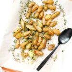 You won't be able to put your fork down once you try one bite of these Roasted Fingerling Potatoes with Garlic and Herbs. A simple side dish that packs a ton of flavor | ThisSavoryVegan.com #thissavoryvegan #vegan #veganpotatoes