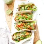 These Crispy Vegan Potato Tacos with Jalapeño Cilantro Sauce are filled with beans, crispy potatoes, crunchy lettuce and the best sauce | ThisSavoryVegan.com #thissavoryvegan #vegantacos #tacotuesday