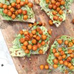 This Roasted Chickpea Avocado Toast steps up the classic vegan breakfast. Toasted bread is topped with smashed avocados, smoky chickpeas and sprouts | ThisSavoryVegan.com #thissavoryvegan #avocadotoast