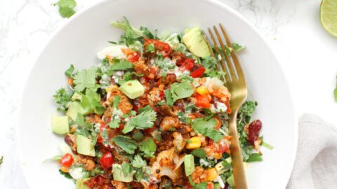 These Cauliflower Taco Bowls with Creamy Vegan Cilantro Ranch are filled with brown rice, bell peppers, onion & beans. A healthy & tasty vegan dinner | ThisSavoryVegan.com #thissavoryvegan #vegan #tacobowl