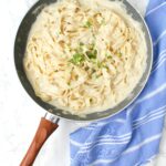 This Vegan Fettuccine Alfredo with Truffle Oil is the ultimate comfort meal. A creamy white wine sauce is combined with fettuccine noodles then topped with truffle oil | ThisSavoryVegan.com #thissavoryvegan #vegan #veganalfredo