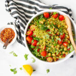 This Vegan Mediterranean Couscous Salad is packed full of pearl couscous, chickpeas, sun-dried tomatoes, cherry tomatoes, pesto and arugula | ThisSavoryVegan.com #thissavoryvegan #vegan #vegansalad