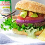 These Vegan Cajun Black Bean Burgers are loaded with a zesty patty, cajun aioli and an avocado salsa. The ultimate combo of flavors | ThisSavoryVegan.com #thissavoryvegan #veganburger #TonyChacheres #CreoleCanDo #ad