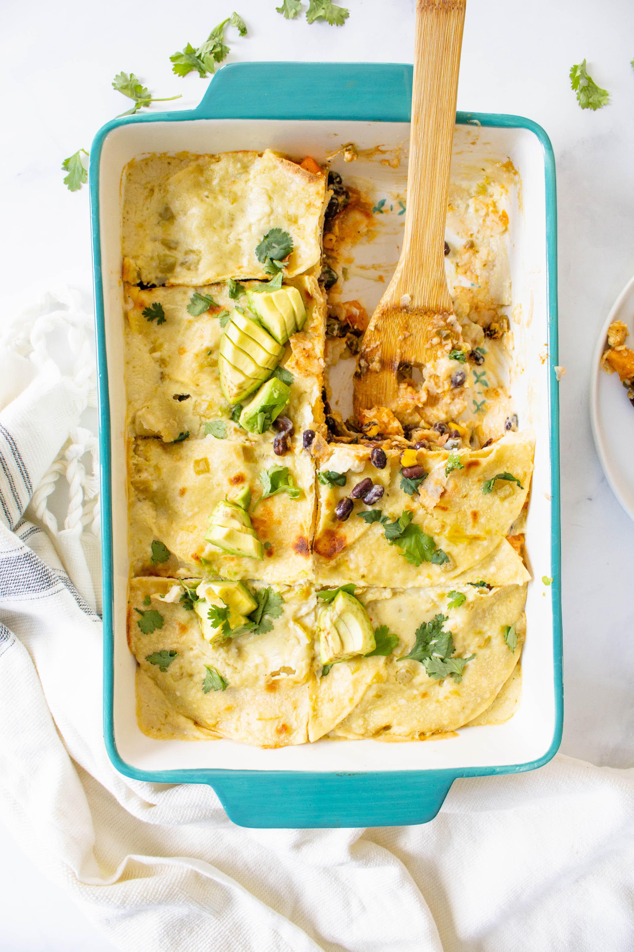 This Vegan Butternut Squash Poblano Enchilada Casserole is creamy, savory and filled with black beans and roasted veggies. Perfect weeknight dinner | ThisSavoryVegan.com #thissavoryvegan #veganenchiladas