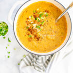 This Vegan Sausage & Potato Beer Cheese Soup is creamy comfort in a bowl. A hearty vegan soup that can be served with crusty bread and green onion | ThisSavoryVegan.com #thissavoryvegan #beercheesesoup #vegansoup