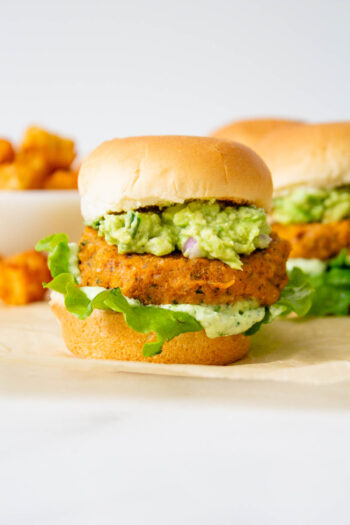 These Buffalo Chickpea Sliders with Vegan Basil Aioli are totally delicious! Whether you serve these at a party or for dinner, they are always a crowd pleaser | ThisSavoryVegan.com #thissavoryvegan #vegansliders #veganpartysnacks