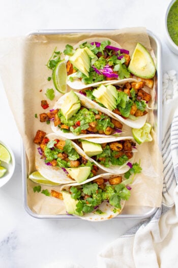 These Roasted Potato Tacos with Chimichurri are perfectly seasoned, bursting with flavor and the perfect at home vegan Taco Tuesday meal! | ThisSavoryVegan.com #thissavoryvegan #vegantacos