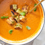 This Tomato Basil Soup with Vegan Grilled Cheese Croutons is made of a bunch of roasted veggies, basil pesto and the best croutons you've ever had | ThisSavoryVegan.com #thissavoryvegan #vegansoup #vegangrilledcheese