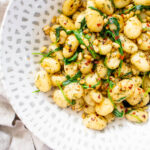This Vegan Brown Butter Gnocchi with Fresh Herbs is a simple and flavorful dish. A savory meal that vegans and non-vegans will definitely enjoy | ThisSavoryVegan.com #thissavoryvegan #vegangnocchi #veganpasta