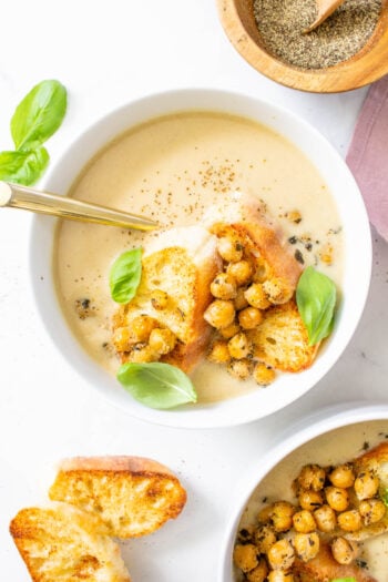 This Roasted Cauliflower Soup with Basil Chickpeas is the most comforting and delicious vegan meal. The chickpeas add the best crunch to this creamy soup | ThisSavoryVegan.com #thissavoryvegan #vegansoup #cauliflower