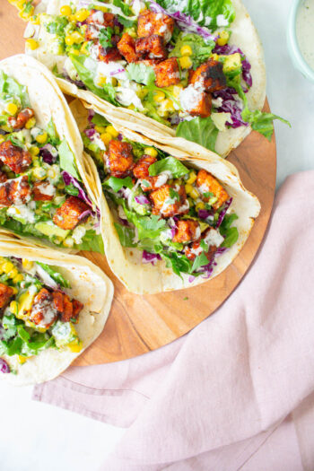 These BBQ Tempeh Tacos with Vegan Ranch are filled with crispy tempeh, avocado salsa, homemade slaw and vegan ranch. The perfect vegan taco | ThisSavoryVegan.com #thissavoryvegan #vegantacos #tempehtacos