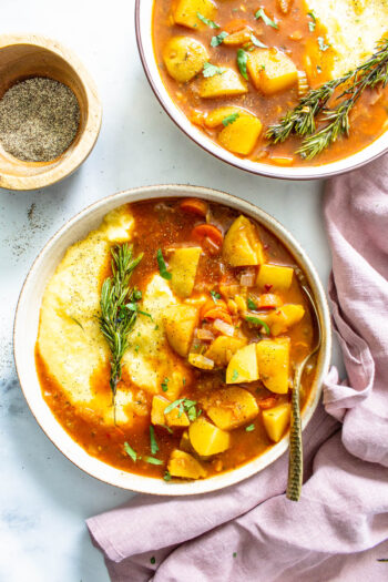 This Vegan Potato Stew with Rosemary Garlic Polenta is a simple dinner that packs tons of flavors and veggies into one easy to make meal | ThisSavoryVegan.com #thissavoryvegan #veganstew #veganpolenta