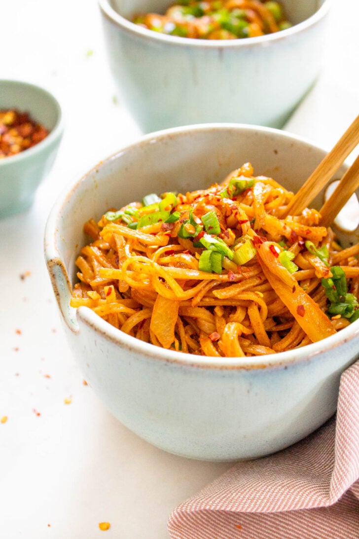 These Spicy Thai Noodles are quick, simple and totally mouthwatering. Bulk them up with extra veggies for a better than takeout vegan dinner at home | ThisSavoryVegan.com #thissavoryvegan #spicynoodles #vegannoodles