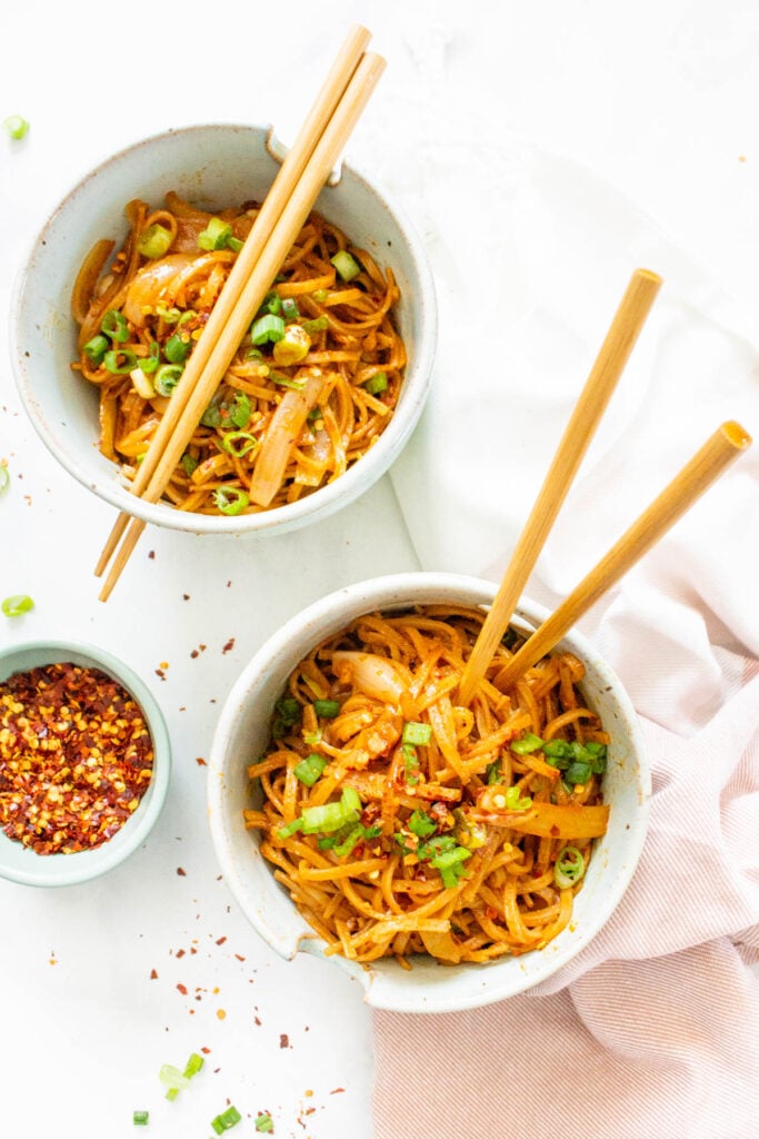 These Spicy Thai Noodles are quick, simple and totally mouthwatering. Bulk them up with extra veggies for a better than takeout vegan dinner at home | ThisSavoryVegan.com #thissavoryvegan #spicynoodles #vegannoodles
