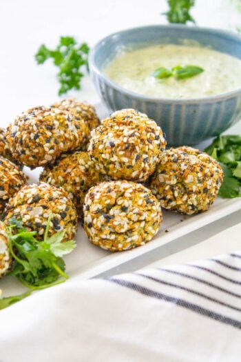 These Air Fryer Falafel Bites with Pesto Dipping Sauce are the perfect vegan snack - covered in everything but the bagel seasoning and perfectly crispy | ThisSavoryVegan.com #thissavoryvegan #falafel #vegansnacks