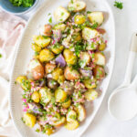 This No Mayo Vegan Potato Salad is packed with LOTS of herbs and an olive oil dressing that is tangy & delicious. The perfect summer side recipe | ThisSavoryVegan.com #thissavoryvegan #veganpotatosalad #summerrecipe