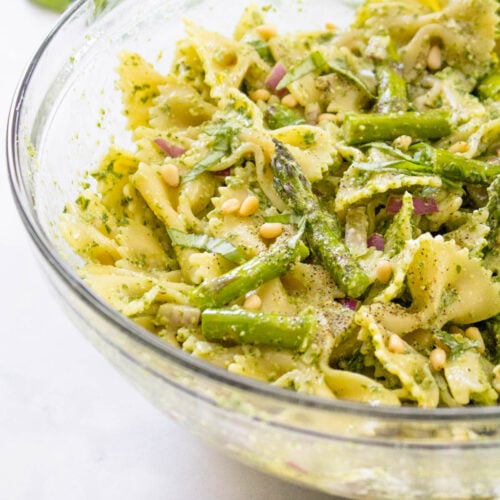 This Grilled Asparagus Pesto Pasta Salad is the perfect side dish for your next vegan BBQ. Homemade vegan pesto, crisp asparagus and chilled pasta | ThisSavoryVegan.com #thissavoryvegan #veganpastasalad #pestopastasalad