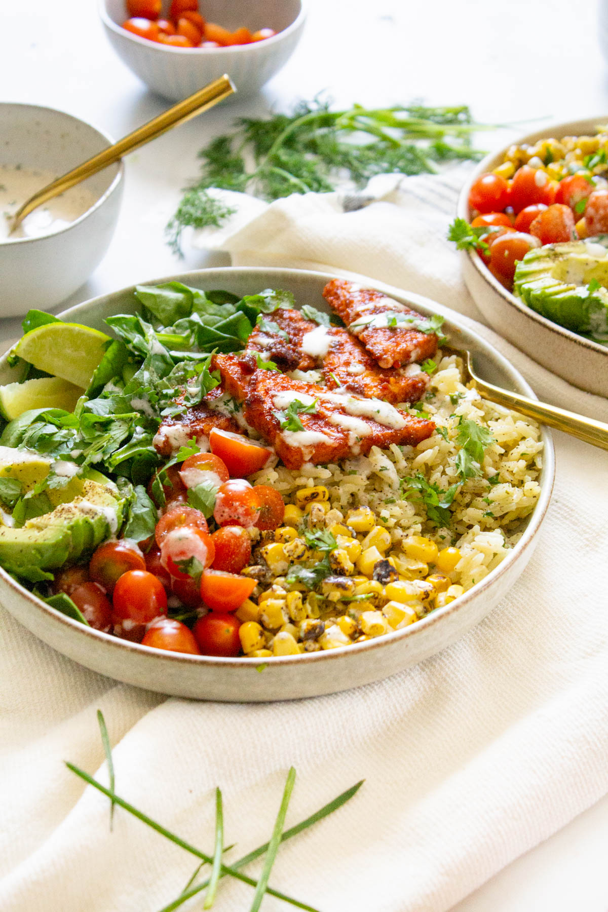 These BBQ Tempeh Bowls with Garlic Herb Rice are loaded with flavor-packed rice, corn, tomatoes, greens, crispy tempeh and vegan dressing. Perfect for meal prepping | ThisSavoryVegan.com #thissavoryvegan #veganbowls #bbqtempeh