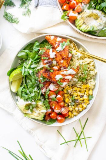 These BBQ Tempeh Bowls with Garlic Herb Rice are loaded with flavor-packed rice, corn, tomatoes, greens, crispy tempeh and vegan dressing. Perfect for meal prepping | ThisSavoryVegan.com #thissavoryvegan #veganbowls #bbqtempeh