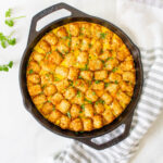 This Vegan Tater Tot Breakfast Casserole is loaded with vegan eggs, vegan sausage, tempeh bacon and veggies. The perfect vegan brunch or meal prep breakfast | ThisSavoryVegan.com #thissavoryvegan #veganbrunch #vegancasserole
