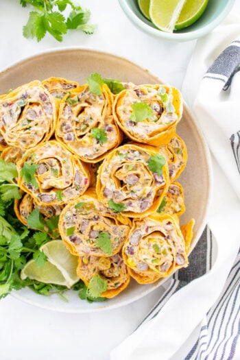 These Simple Vegan Taco Pinwheels are the perfect party appetizer, make ahead lunch or easy snack. No need to cook when you can eat a pinwheel instead | ThisSavoryVegan.com #thissavoryvegan #veganwrap #veganpinwheels