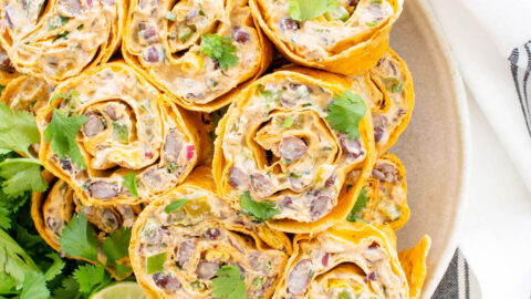 These Simple Vegan Taco Pinwheels are the perfect party appetizer, make ahead lunch or easy snack. No need to cook when you can eat a pinwheel instead | ThisSavoryVegan.com #thissavoryvegan #veganwrap #veganpinwheels