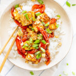 These Vegan Kung Pao Tofu Bowls are a better than takeout vegan dinner at home. Filled with sticky, savory & sweet tofu, red bell pepper & rice | ThisSavoryVegan.com #thissavoryvegan #kungpao #tofurecipes
