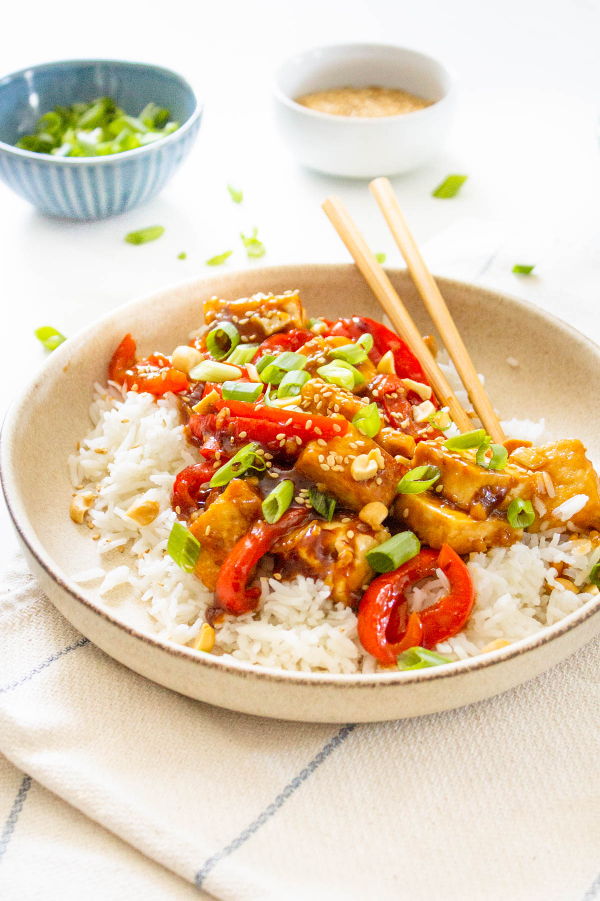 These Vegan Kung Pao Tofu Bowls are a better than takeout vegan dinner at home. Filled with sticky, savory & sweet tofu, red bell pepper & rice | ThisSavoryVegan.com #thissavoryvegan #kungpao #tofurecipes