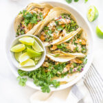 These Vegan Lemon Pepper Chicken Tacos are loaded with a kale avocado slaw and a chili lime crema. Perfect for your next Taco Tuesday | ThisSavoryVegan.com #thissavoryvegan #vegantacos #lemonpepperchicken