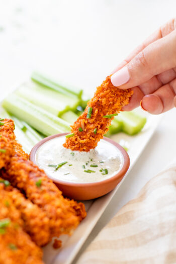 This Air Fryer Buffalo Tempeh is perfectly crispy & spicy. Serve as an appetizer with some vegan ranch or over a salad for a healthy dinner | ThisSavoryVegan.com #thissavoryvegan #airfryerrecipe #buffalotempeh