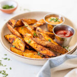 These Air Fryer Potato Wedges are perfectly crunchy, smoky and garlicky. Serve them with your favorite dipping sauce for a snack or side dish | ThisSavoryVegan.com #thissavoryvegan #airfryerrecipe #potatowedges