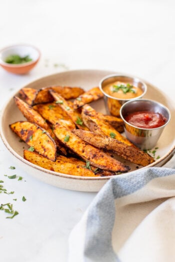 These Air Fryer Potato Wedges are perfectly crunchy, smoky and garlicky. Serve them with your favorite dipping sauce for a snack or side dish | ThisSavoryVegan.com #thissavoryvegan #airfryerrecipe #potatowedges