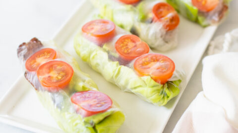 These Vegan BLT Summer Rolls are the perfect cold lunch or snack. Loaded with tempeh bacon, cherry tomatoes, butter lettuce & avocado. Served with Vegan Cilantro Ranch | ThisSavoryVegan.com #thissavoryvegan #summerrolls #veganblt